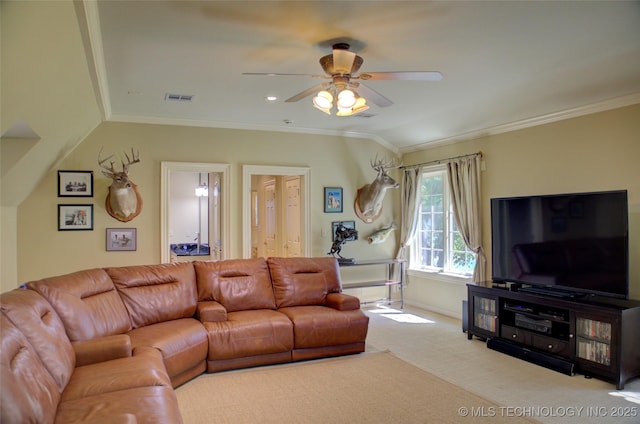 carpeted living room with ornamental molding and ceiling fan