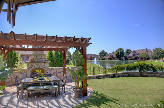 view of patio with a pergola, an outdoor stone fireplace, and a water view