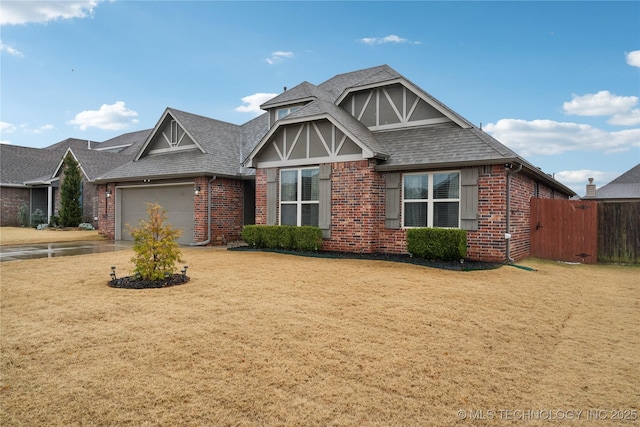 view of front of home with a garage and a front lawn