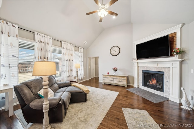 living room with dark wood-type flooring, high vaulted ceiling, and ceiling fan