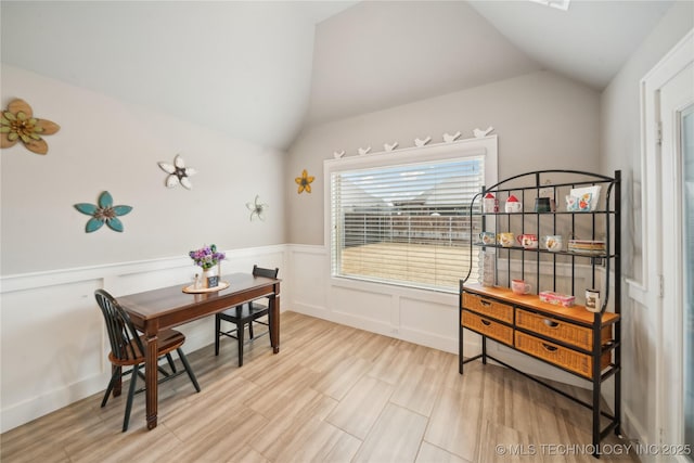 interior space with vaulted ceiling and light hardwood / wood-style flooring