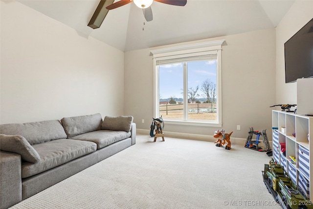 carpeted living room featuring vaulted ceiling and ceiling fan