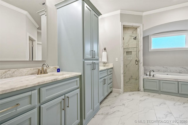 bathroom featuring vanity, ornamental molding, and shower with separate bathtub