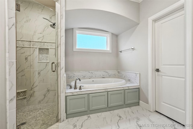 bathroom with shower with separate bathtub