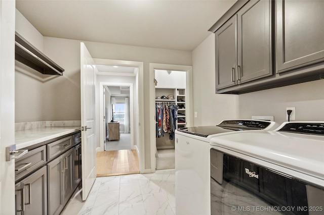 laundry area featuring cabinets and washer and dryer