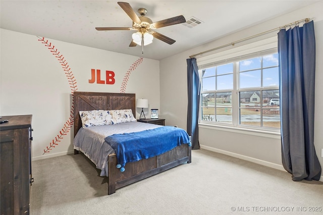 bedroom with ceiling fan and carpet