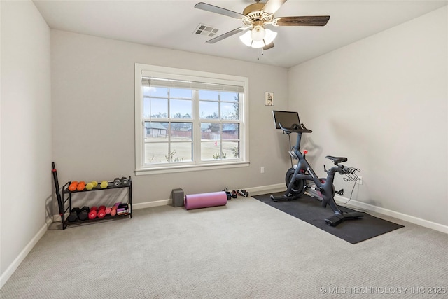 workout area with ceiling fan and carpet flooring