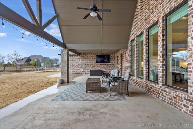 view of patio with a trampoline and ceiling fan