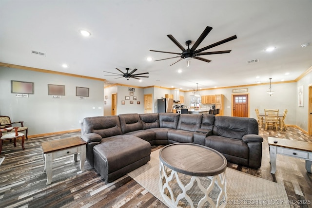 living room with wood-type flooring, crown molding, and ceiling fan