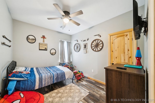 bedroom with hardwood / wood-style flooring and ceiling fan