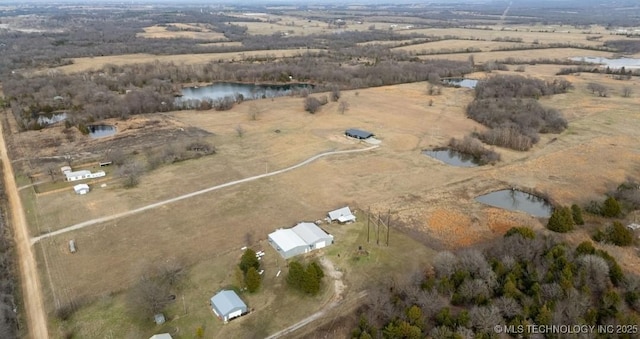 drone / aerial view featuring a water view and a rural view