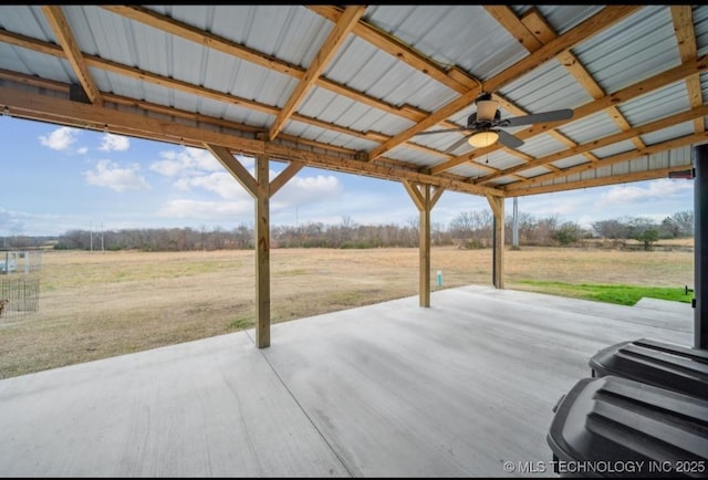 view of patio featuring ceiling fan and a rural view