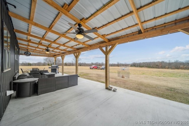 view of patio / terrace with a rural view, area for grilling, and ceiling fan