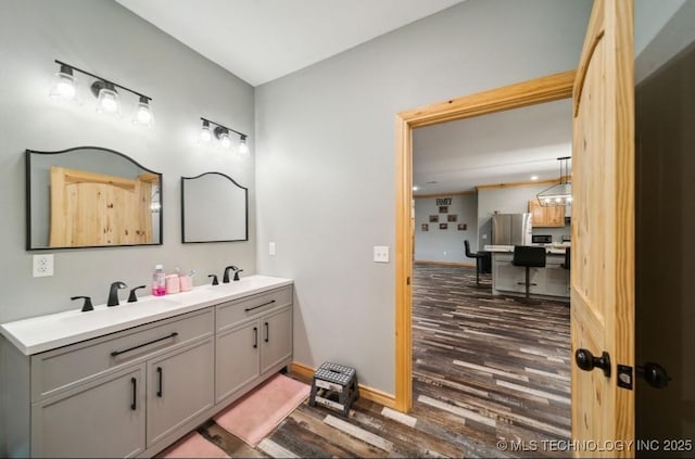 bathroom featuring vanity and hardwood / wood-style floors