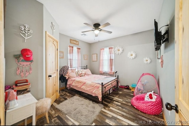 bedroom with dark wood-type flooring and ceiling fan