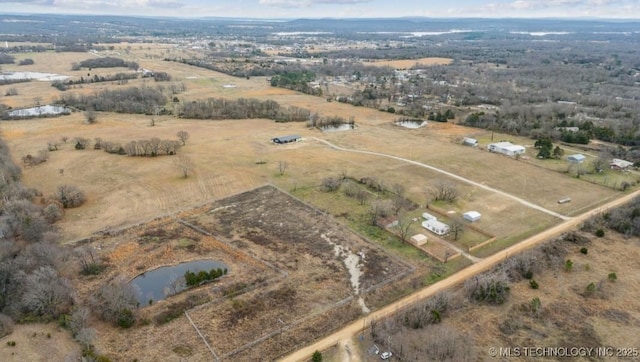 drone / aerial view with a rural view and a water view