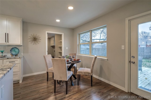 dining room with dark wood-type flooring