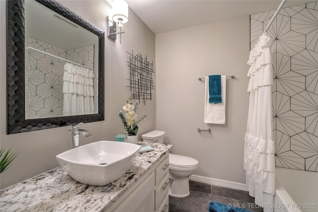 full bathroom featuring vanity, shower / bath combo, and toilet