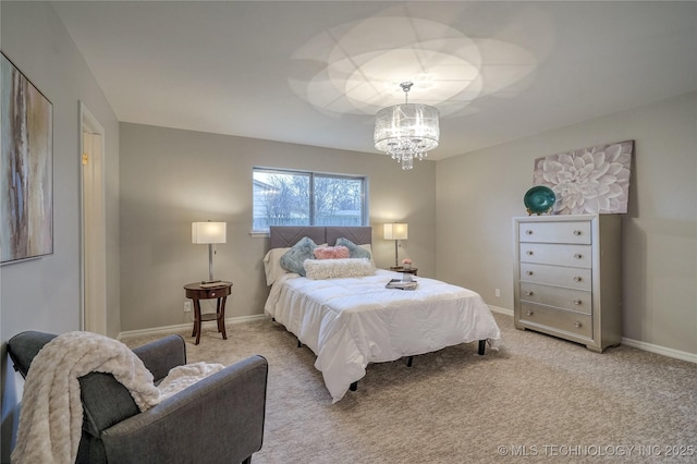 bedroom featuring carpet and a chandelier