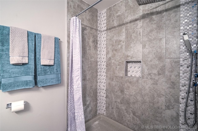 bathroom with a shower with shower curtain