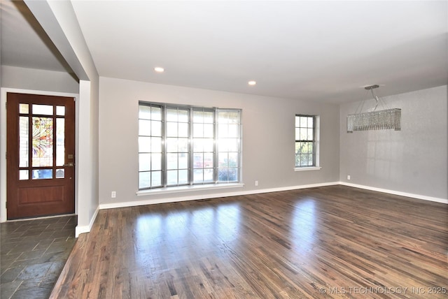 entryway with dark hardwood / wood-style floors