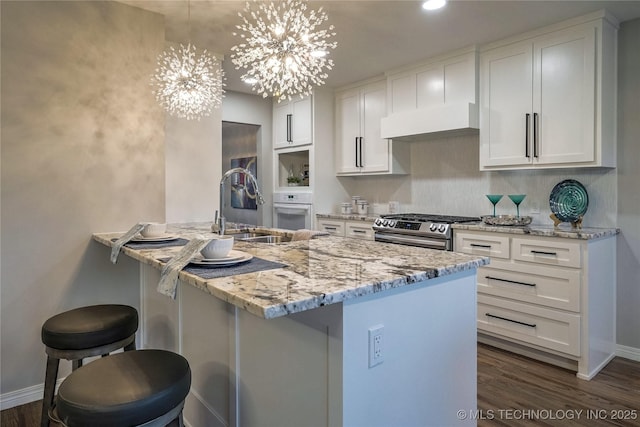 kitchen featuring white cabinetry, sink, and stainless steel range with gas cooktop