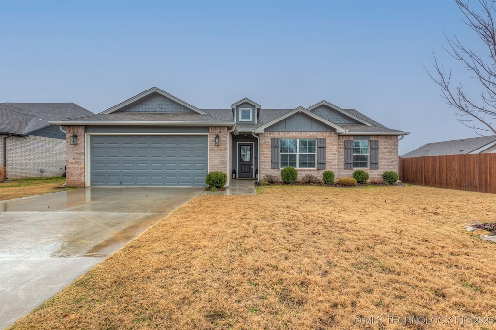 view of front of house featuring a garage and a front yard