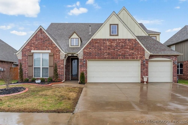 view of front of home featuring a garage and a front lawn