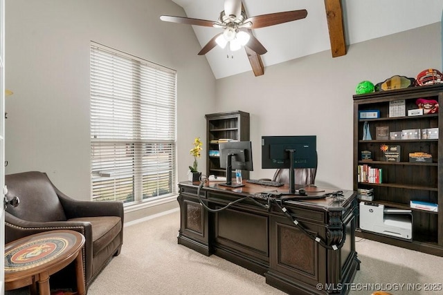 office space featuring a ceiling fan, light colored carpet, lofted ceiling with beams, and baseboards