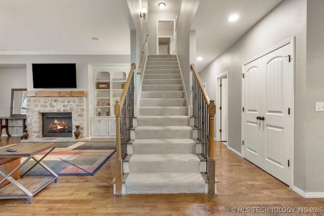 stairway featuring wood-type flooring