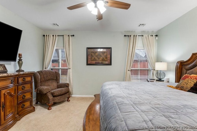 bedroom with light colored carpet and ceiling fan