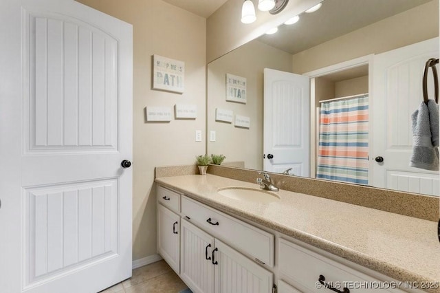 bathroom with vanity and tile patterned floors