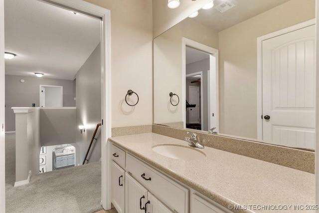 bathroom with visible vents and vanity