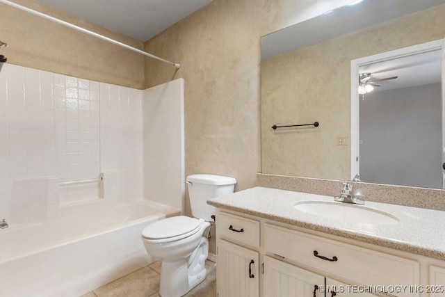 bathroom featuring ceiling fan, tile patterned flooring, bathtub / shower combination, vanity, and toilet