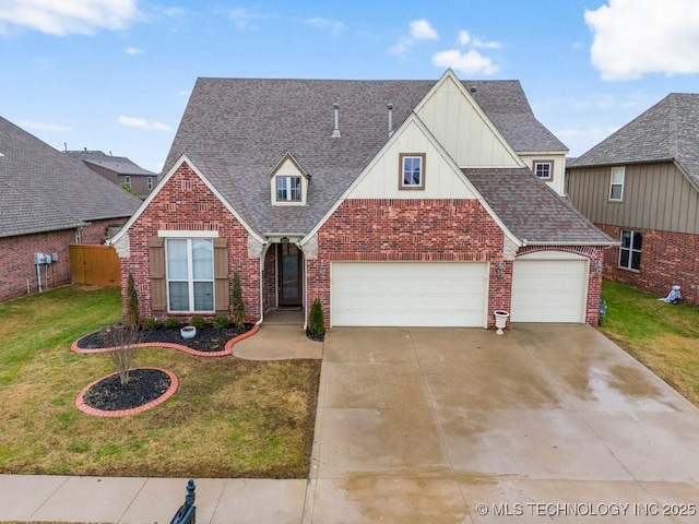 view of front of property with a garage, driveway, roof with shingles, a front lawn, and brick siding