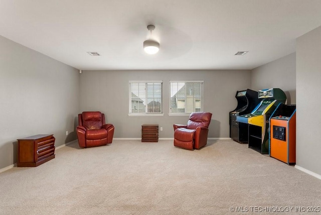 living area featuring carpet floors, visible vents, and baseboards