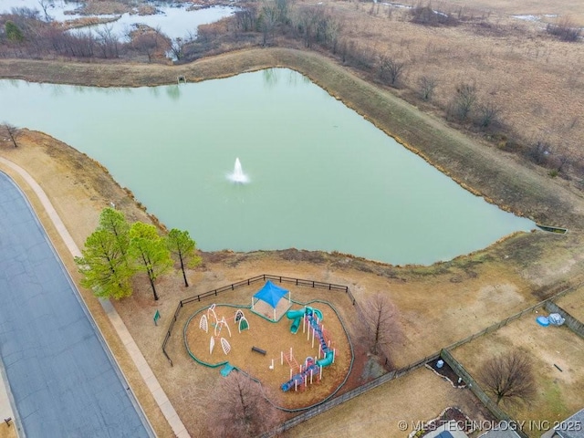 birds eye view of property with a water view