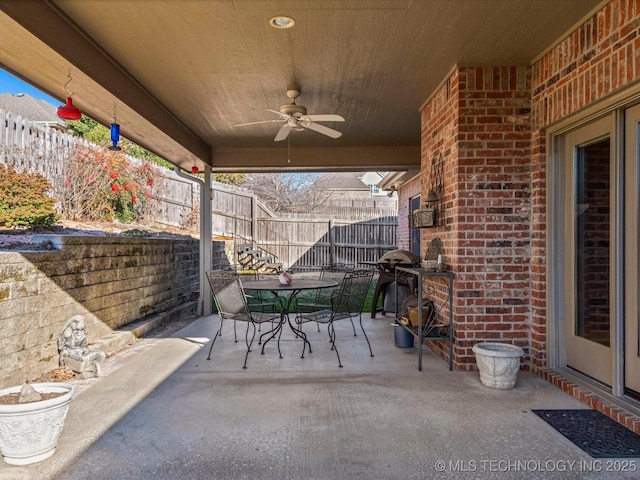 view of patio / terrace featuring ceiling fan