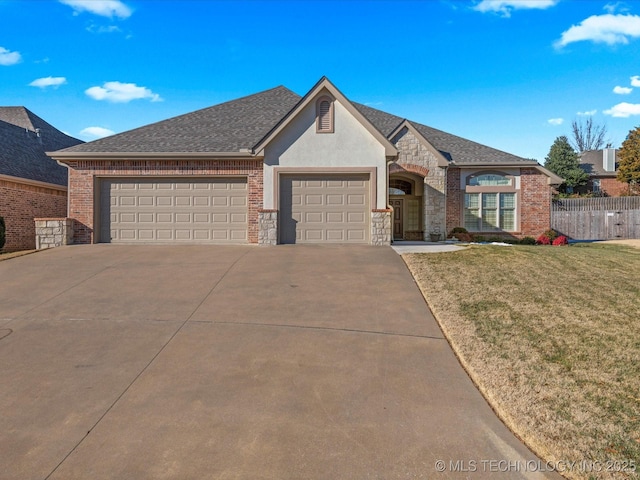 view of front facade with a garage and a front lawn