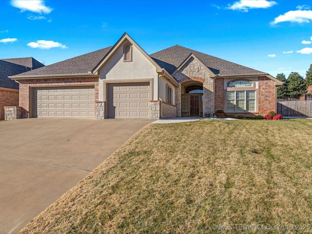 view of front of house featuring a garage and a front yard