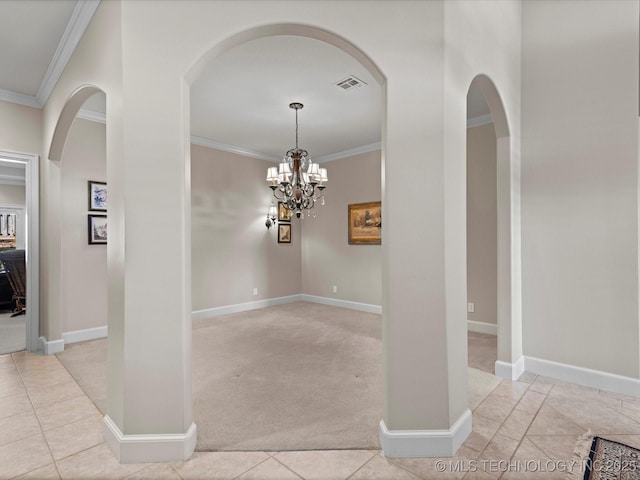 interior space featuring light carpet, crown molding, and an inviting chandelier
