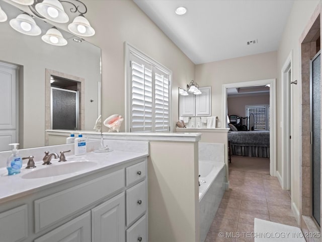bathroom with vanity, separate shower and tub, and tile patterned floors
