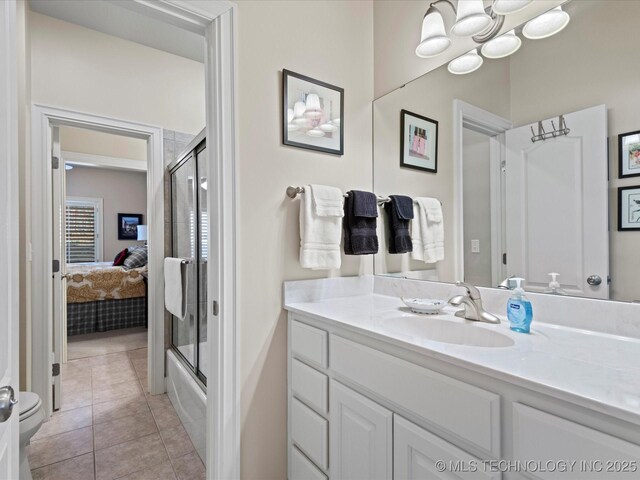 full bathroom with toilet, combined bath / shower with glass door, vanity, a notable chandelier, and tile patterned flooring