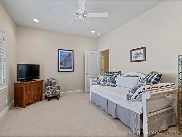 carpeted bedroom with ceiling fan