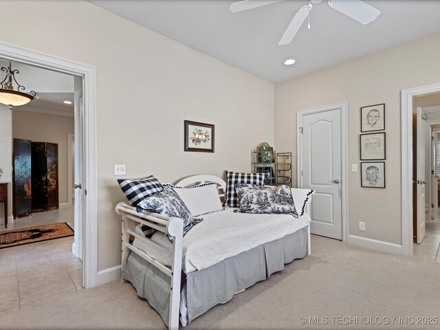 bedroom featuring ceiling fan and light colored carpet