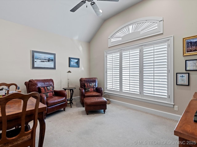 sitting room with ceiling fan, light colored carpet, and lofted ceiling