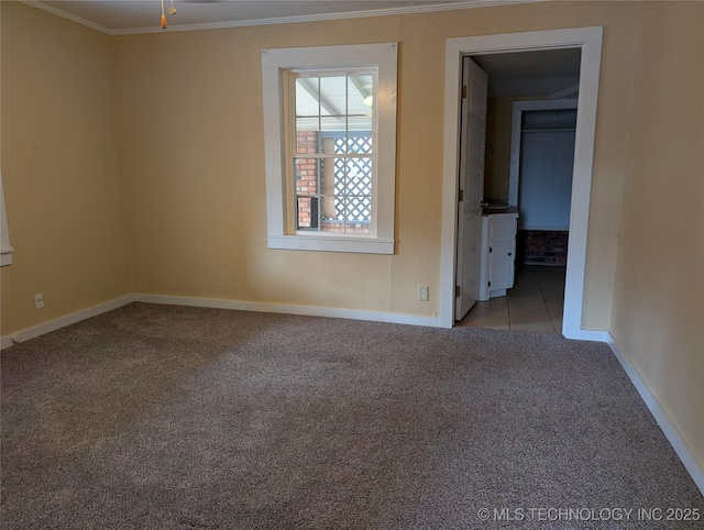 carpeted spare room with ornamental molding