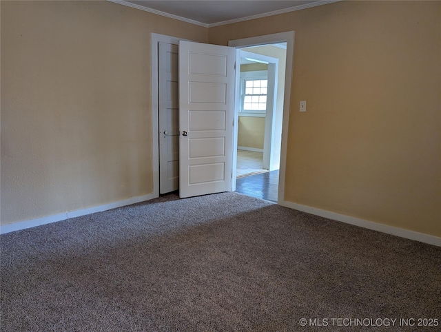 carpeted empty room with crown molding