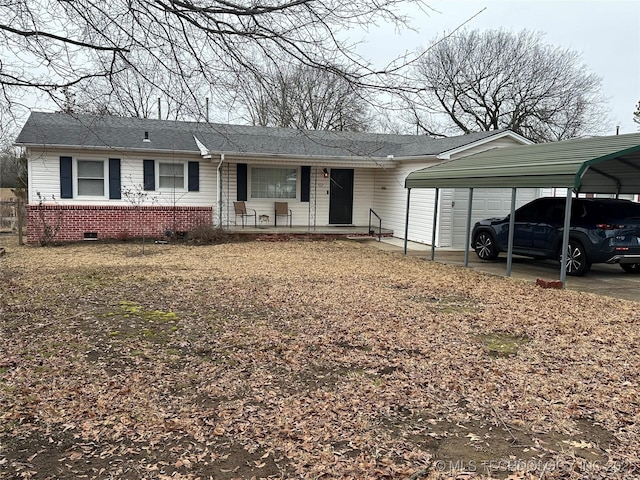 view of front facade featuring a carport and covered porch