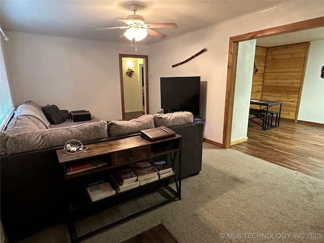 living room featuring carpet floors and ceiling fan